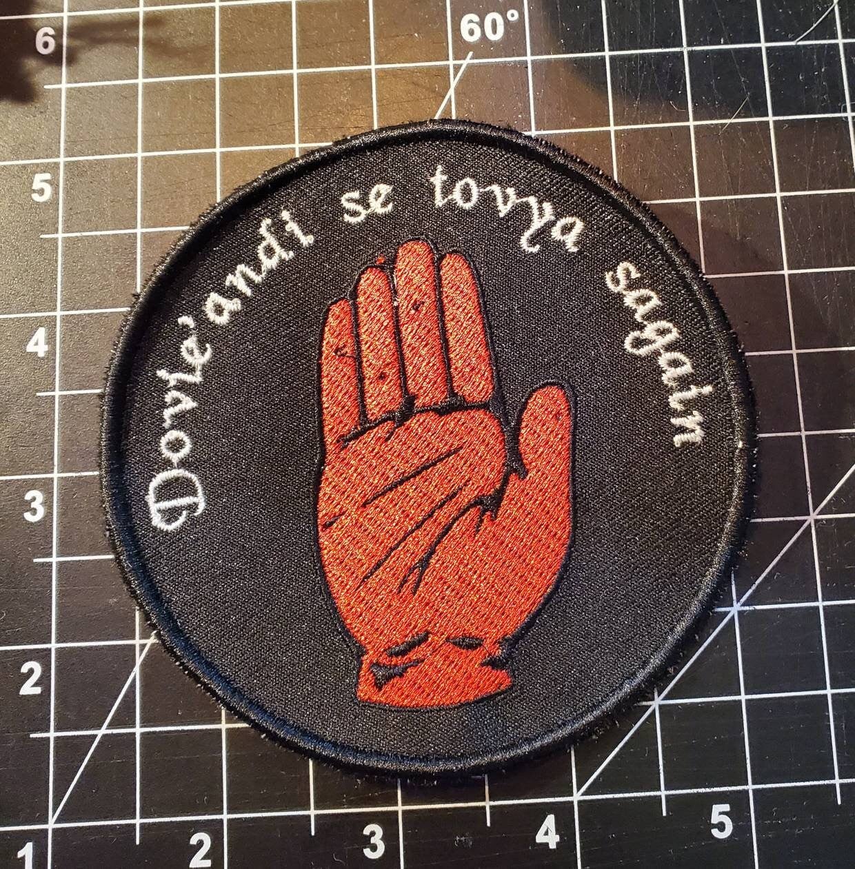 Mat's Red Hand with "It's time to toss the dice" quote Wheel of Time inspired Patch